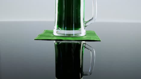 green pint of beer on table for st patricks