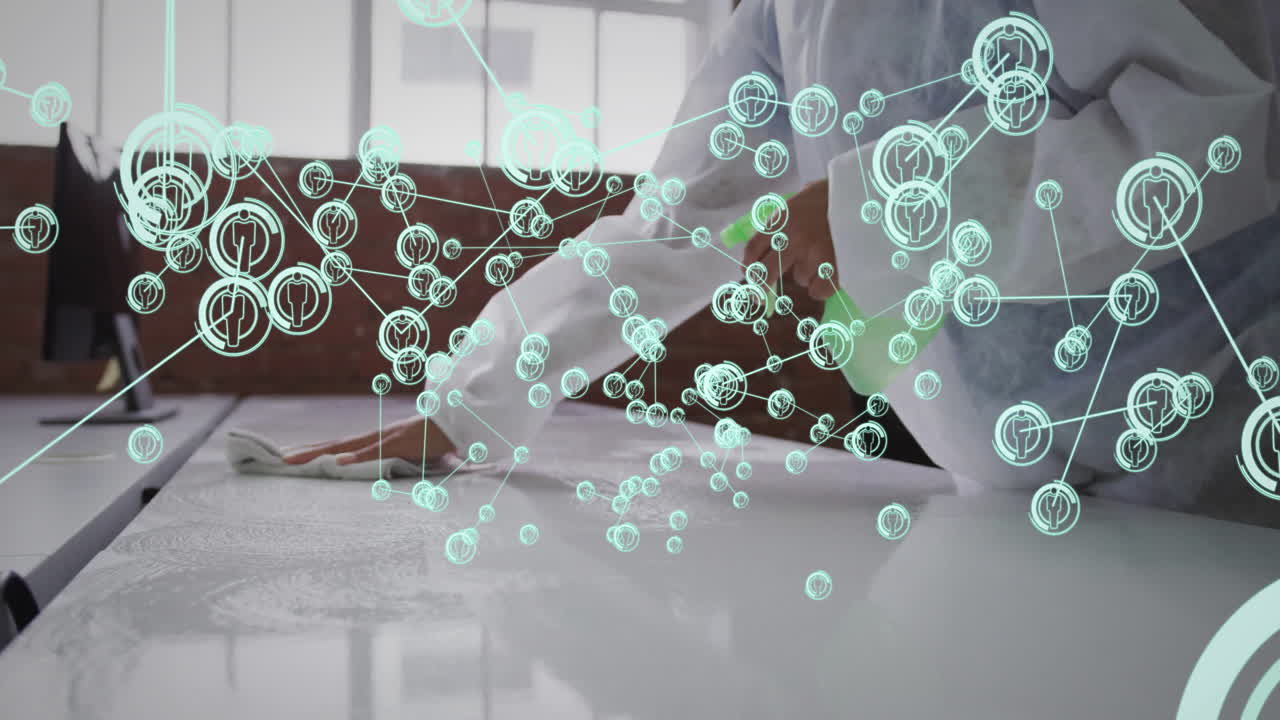 woman cleaning tabletop using green spray bottle in lab, showing network icons with data links