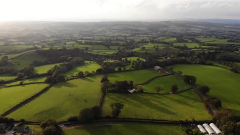 aerial flying over idyllic farm fields in east hill devon