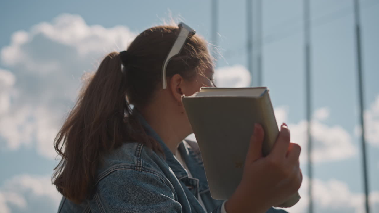 Female individuals engaging with natural surroundings. Women immersed in beauty of seaside landscape. Multiple women appreciating tranquility of coastal environment through reading and gazing