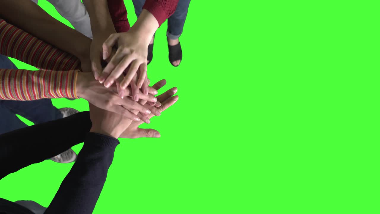 Top view of young students joining their hands