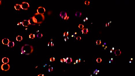 red Soap Bubbles Fly in the Air Black Background many Red Soap Bubbles Fly in the Air Black Background
