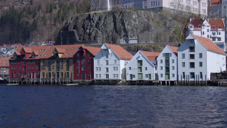wide shot of skuteviksbryggen water front houses and buildings at skutevik at few daysbergen