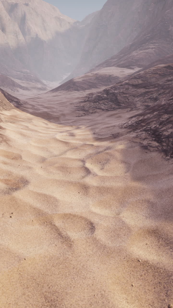 una vista panorámica de un valle desértico con altas montañas en el fondo