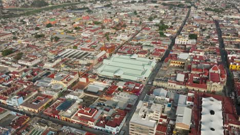 drone : orbit shot of juarez market in downtown oaxaca at sunrise