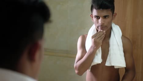 young man grooming in bathroom