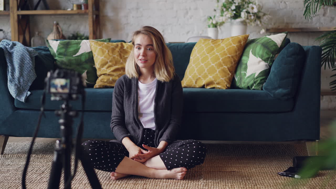 Woman vlogging in living room