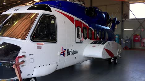 establishing shot of two helicopters in a hanger