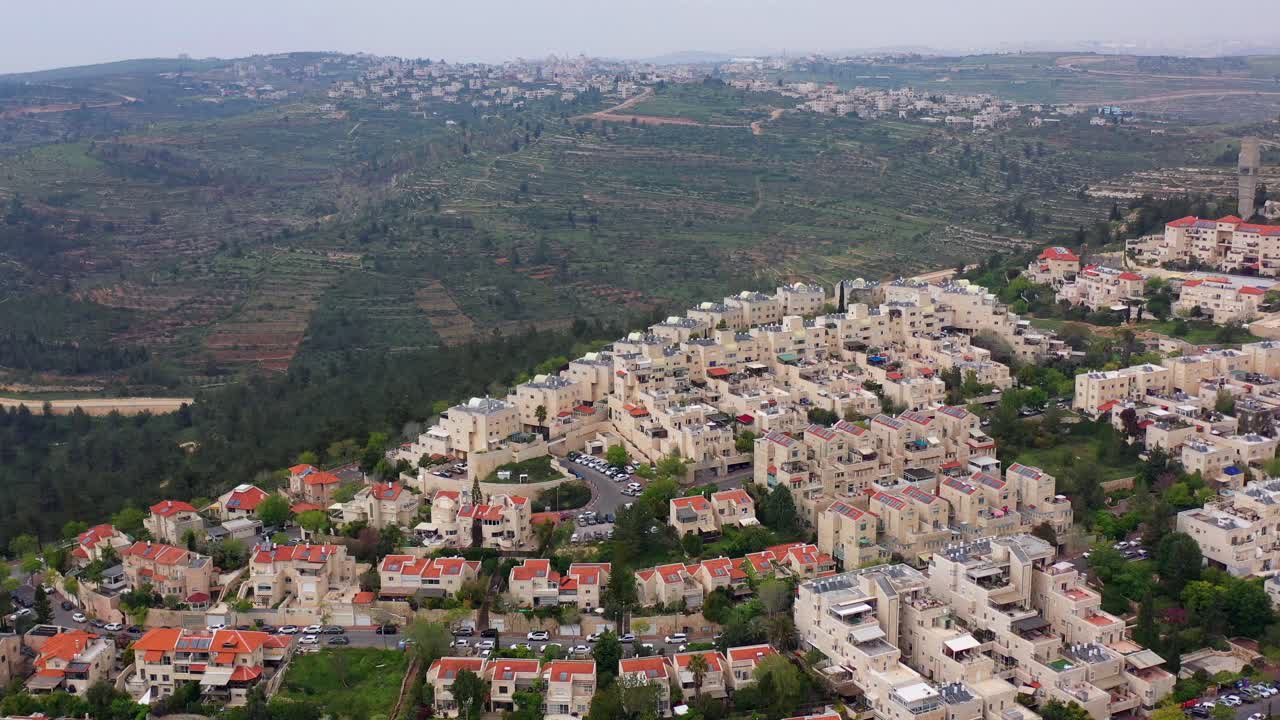 Aerial View of a Hillside Residential Area with Terraced Landscape