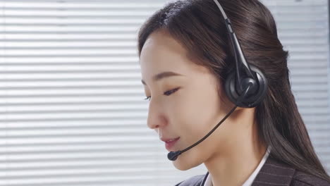 asian business woman with headset in office