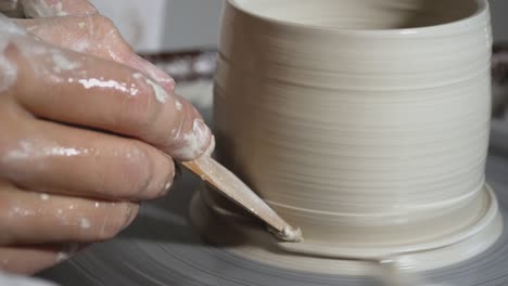 clay pot spinning on pottery wheel