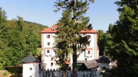 A-drone-shot-over-a-Castle-Snežnik-in-Slovenia