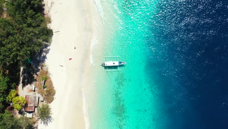 Balinese-boat-waiting-for-tourists-to-come-on-a-beautiful-tour-around-top-destinations-of-fabulous-coastline-of-Indonesia