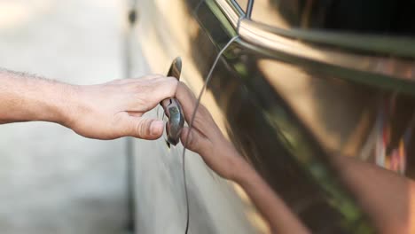 person opening a car door