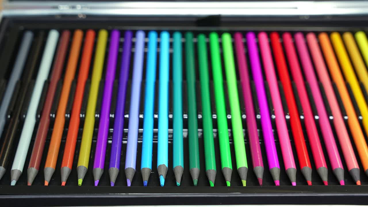 Vivid closeup of neatly aligned colorful pencils forming a rainbow spectrum. Perfect for creativity, education, design, and artistic projects