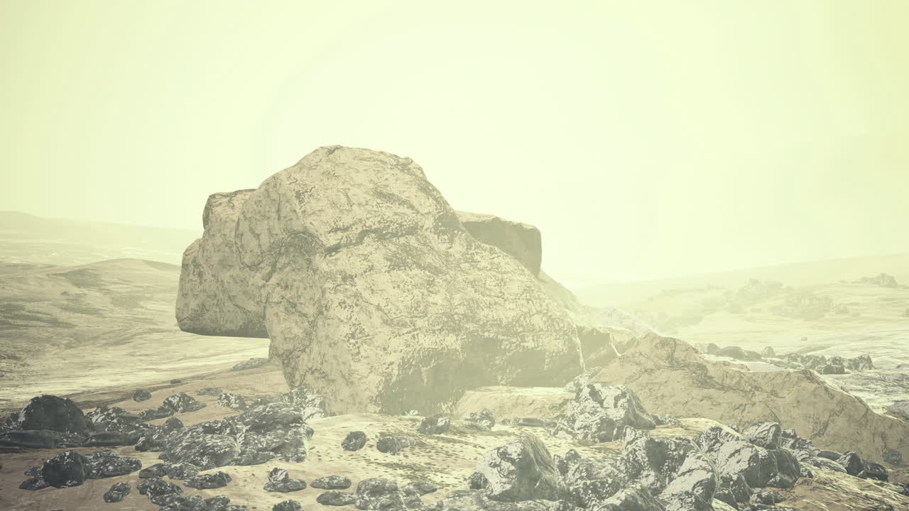 Mysterious large rock formation on a desolate landscape during twilight hours