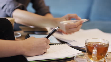 business women meeting in cafe using digital tablet computer