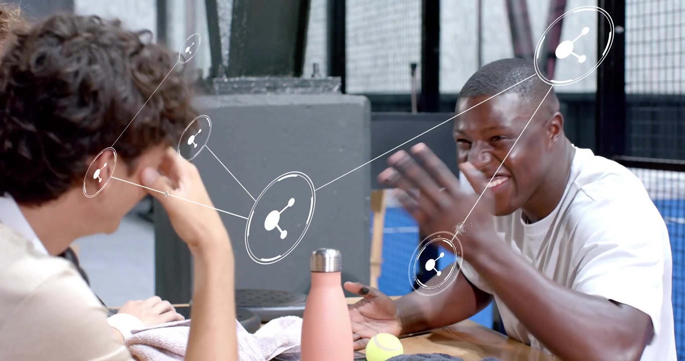 Two men chatting court generating network graphic while hand placing white cup causing reaching