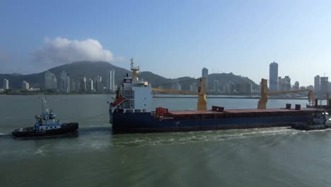 cargo bulk carrier ship navigating the ocean near santa catarina, southern brazil - drone shot