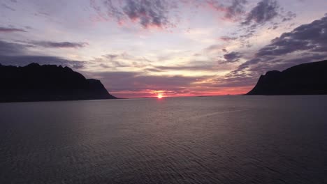 Aerial-of-a-fjord-at-sunset-on-Lofoten,-Norway