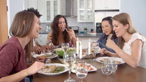 female friends talking at a dinner table, shot on r3d