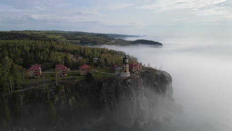 aerial footage foggy summer morning at split rock light house, facing the light house, only in mn, visit minnesota