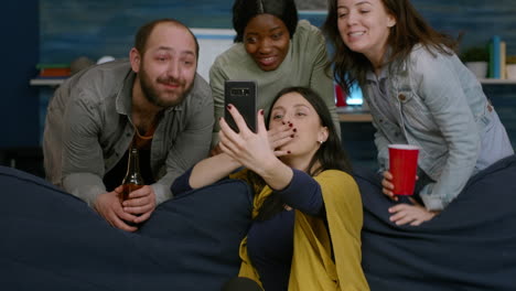 group of multiracial friends having online videocall meeting using mobile