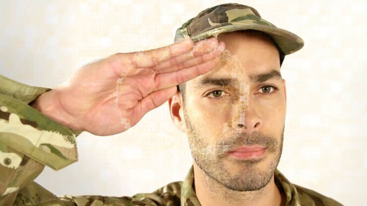 Saluting in camouflage uniform, military person with digital animation overlay effect