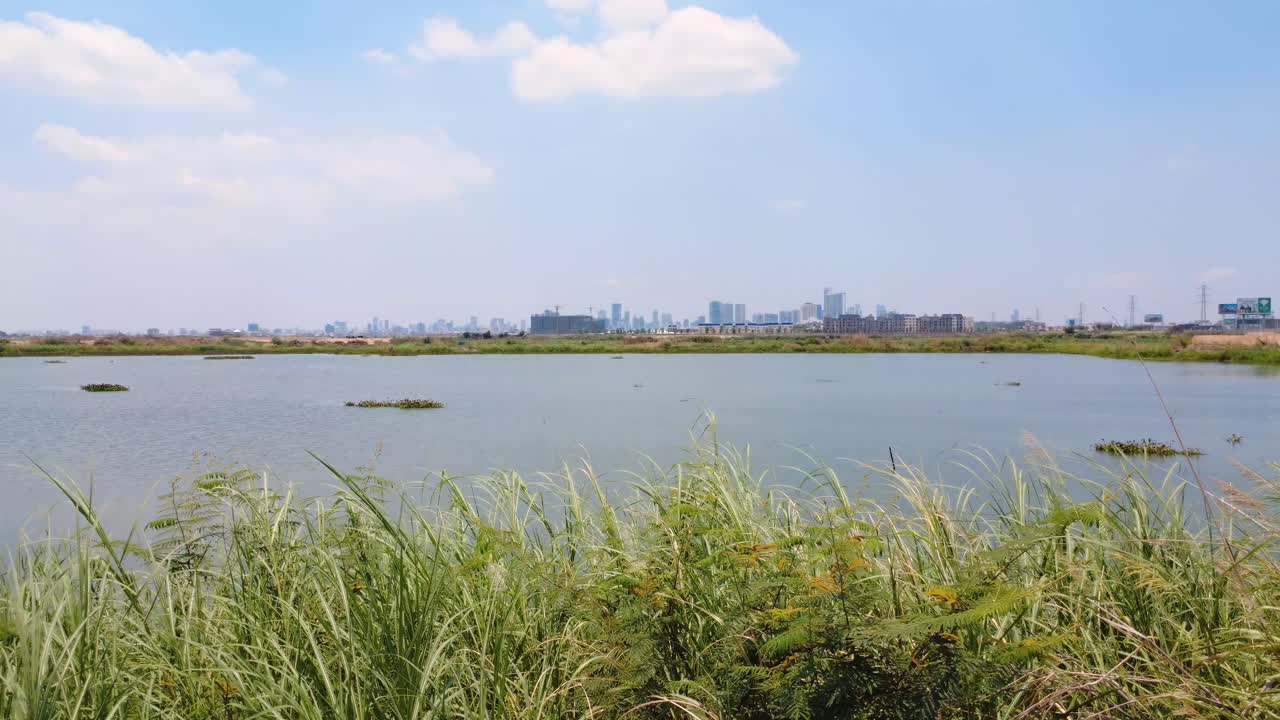 Distant Phnom Penh City, lakeside scenery, freshwater location, aerial