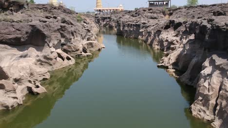 aerial drone footage of a river with potholes - at nighoj near pune and is famous for the naturally created potholes on the riverbed of the kukadi river