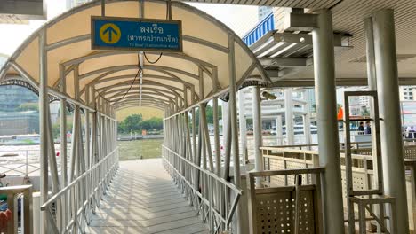 people walking through ferry terminal walkway