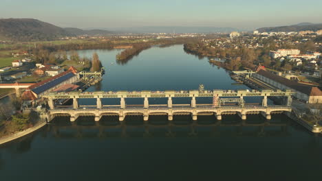 Person-on-a-bicycle-driving-over-the-Hydro-power-plant-over-the-Rhine-in-Augst-between-Switzerland-and-Germany