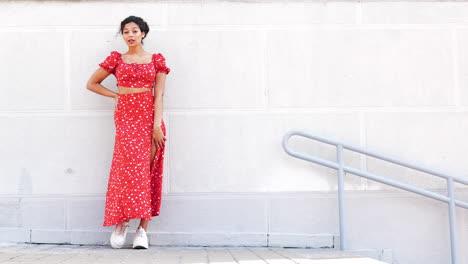 woman in a red floral print dress