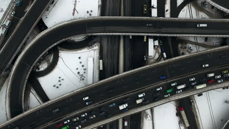 Car-traffic-on-highway-junction-in-winter-city.-Top-view-car-jam-on-freeway