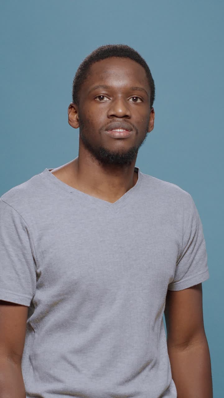Portrait of a Smiling Man with Arms Crossed