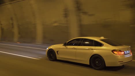 car passing through highway tunnel.