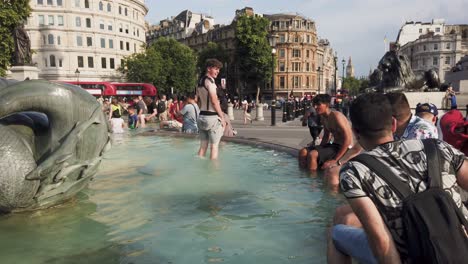 trafalgar square, london, england -  19-july-2022, the fountains trafalgar square - on a hot summers day