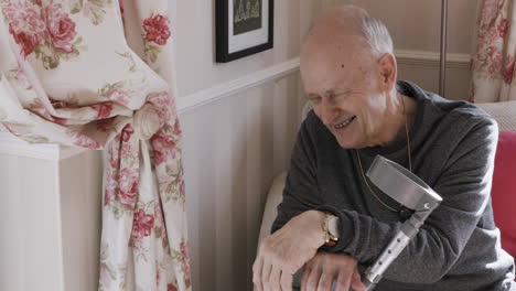 Elderly man with crutch
