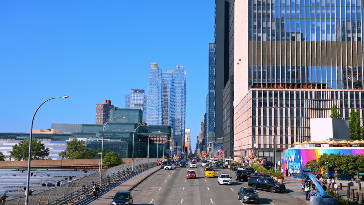 New York, USA, 8 July 2025: Lots of cars approach by the multi-lane street of New York, USA. Vibrant lifestyle of metropolis at daytime