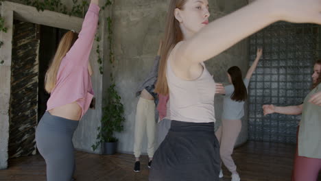 group of young women dancing in a dance studio