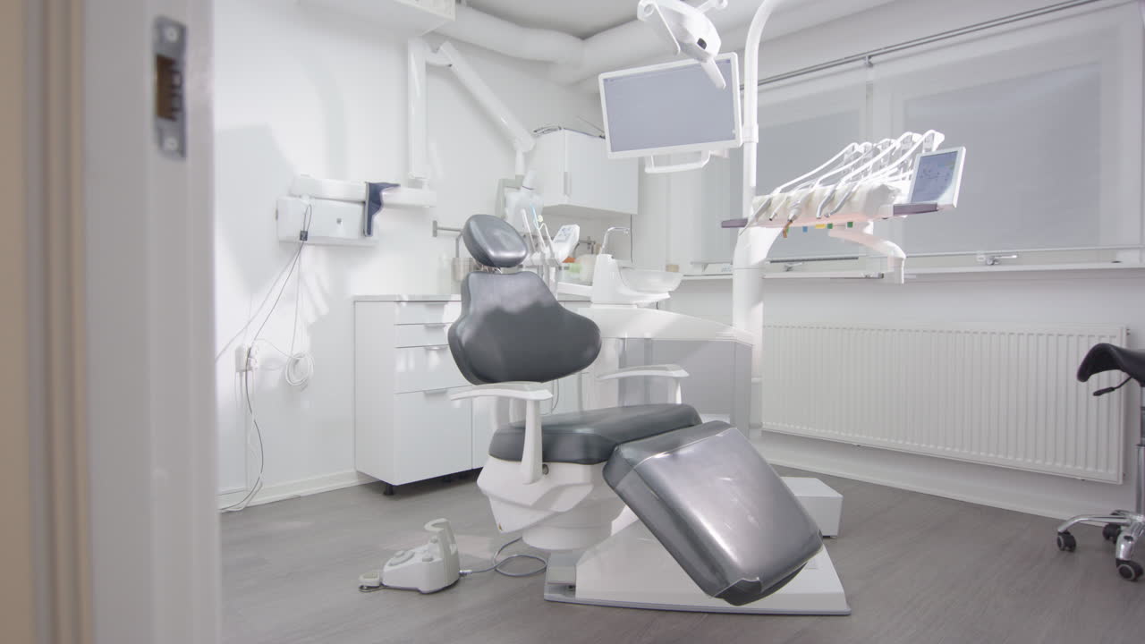 Empty dental office with chair, tools and equipment used for oral care, slider