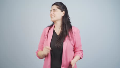 Business-woman-dancing-with-phone-in-hand.