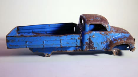 old and rusty vintage soviet era metal tinplate toy truck without wheels