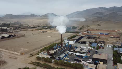 Smoke-plume-rising-out-of-a-factory-chimney