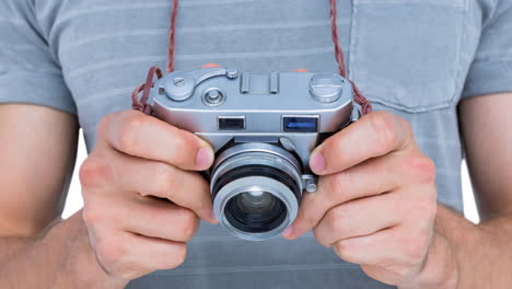 animation of caucasian man holding camera over white background