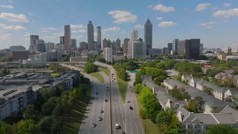 aerial view of modern metropolis, rows of residential houses in urban borough and skyline with downtown skyscrapers