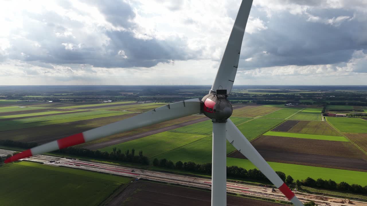 Renewable energy from the wind, wind turbine. Close up aerial video. Clean energy transistion