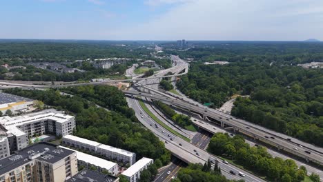 aerial shot rotating around interstate 85 and ga 400 during a summer day in atlanta