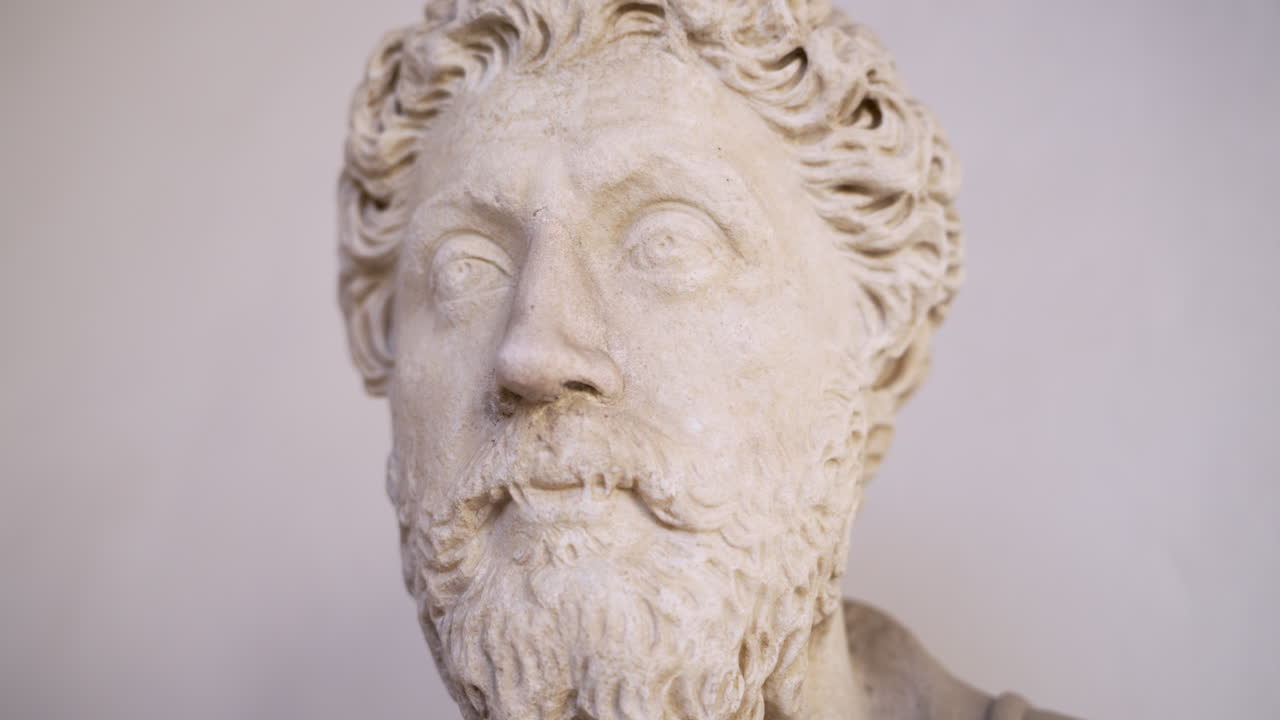 Gentle gimbal shot around the stone head bust of ancient Roman emperor and Stoic meditations philosopher, Marcus Aurelius.