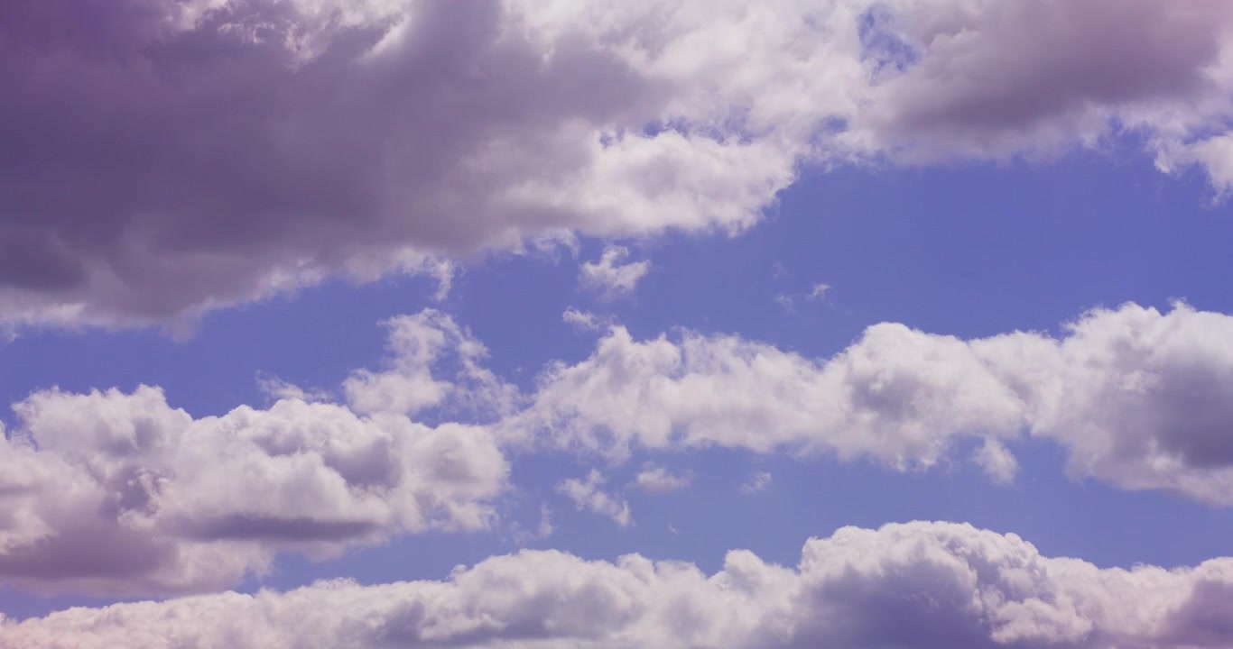Time Lapse of Fluffy White Cumulus Clouds Moving Across a Blue Sky